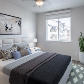 Bedroom ceiling fan with light fixture in bedroom with area rug